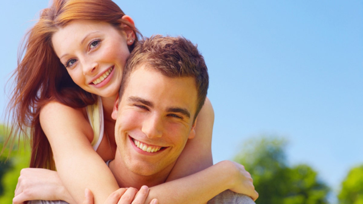 Woman embracing her boyfriend