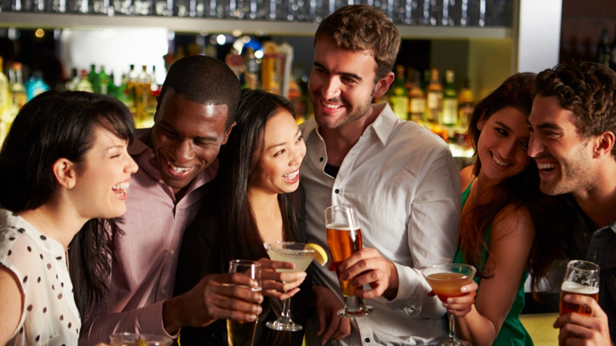 Group Of Friends Enjoying Drink In Bar