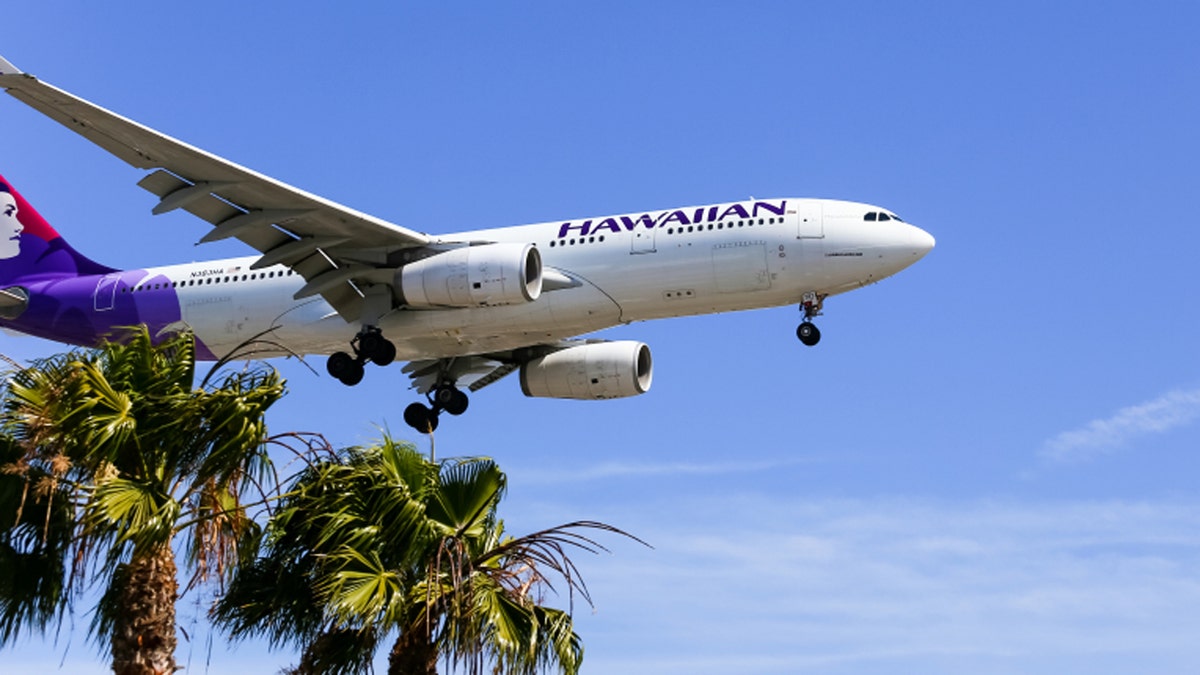 Los Angeles, USA - May 30, 2015: An airplane of Hawaiian Airlines landing at Los Angeles International Airport.