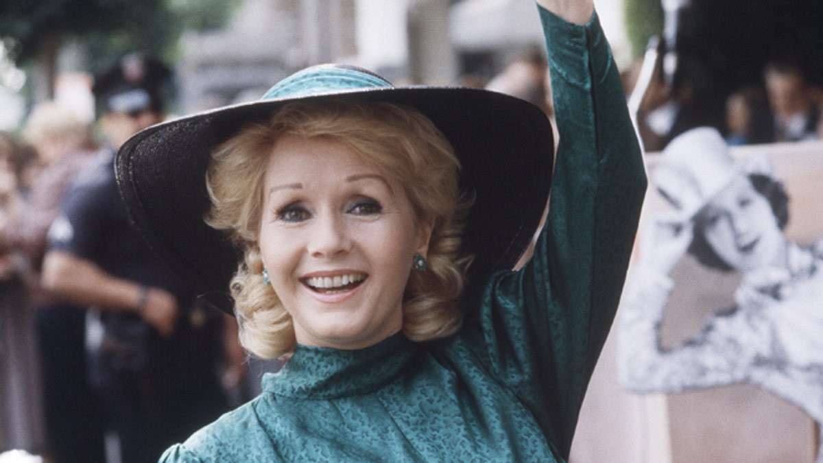 FILE- In this Feb. 15, 1984, file photo, actress Debbie Reynolds appears at Hollywood Walk of Fame ceremonies in Los Angeles. Reynolds, star of the 1952 classic 