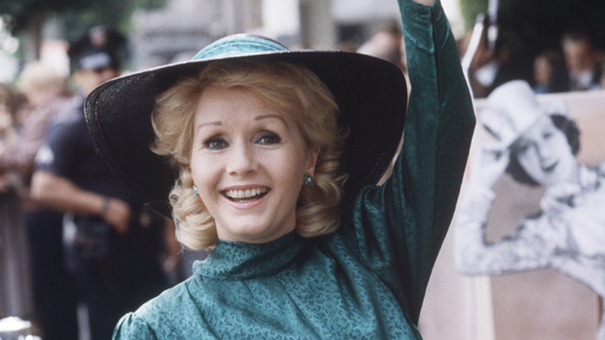 FILE- In this Feb. 15, 1984, file photo, actress Debbie Reynolds appears at Hollywood Walk of Fame ceremonies in Los Angeles. Reynolds, star of the 1952 classic 