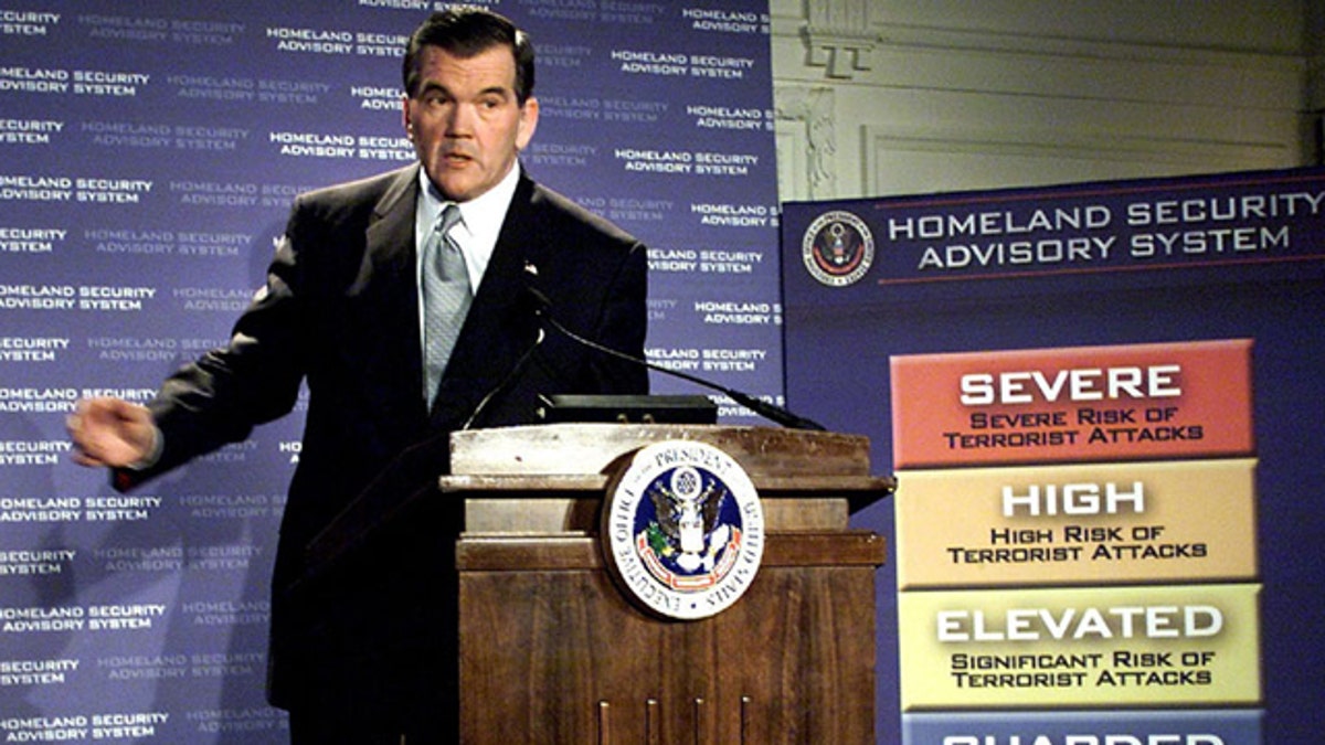In this March 12, 2002, file photo, then-Homeland Security Director Tom Ridge discusses a color-coded terror alert system in Washington. (AP Photo)