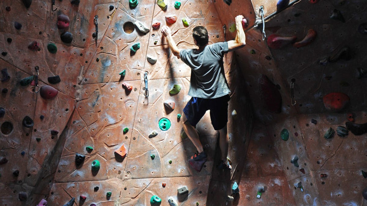 Rock climber on indoor climbing gym