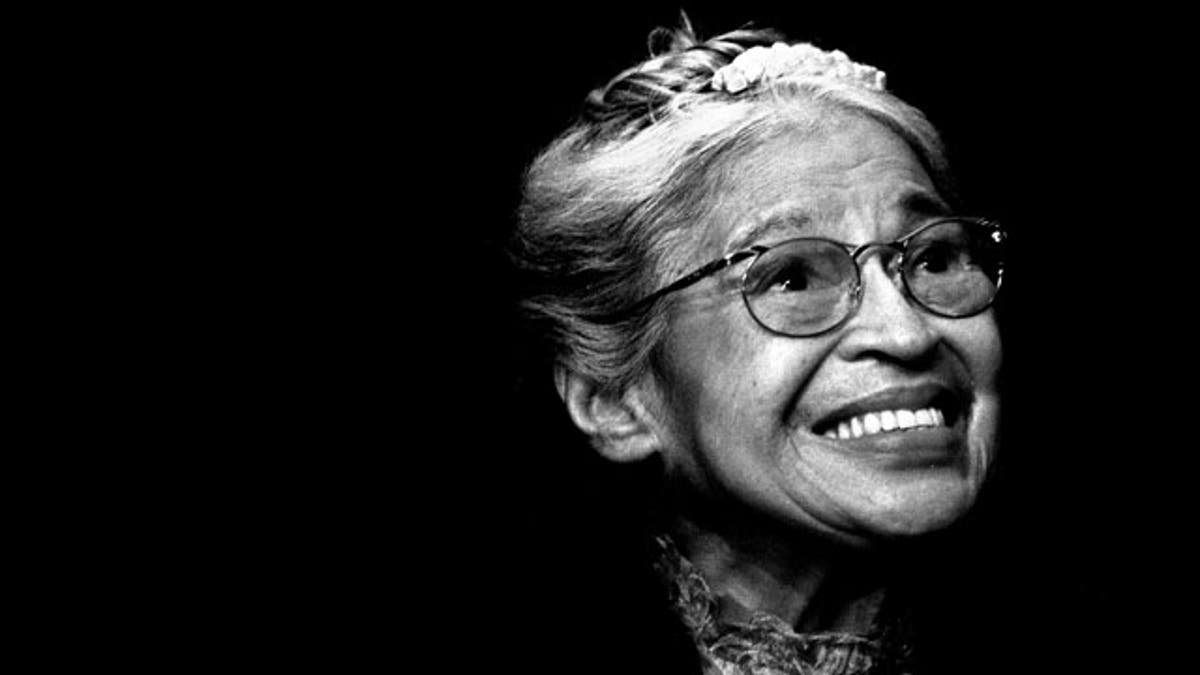 In this Nov. 28, 1999 file photo, Rosa Parks smiles during a ceremony where she received the Congressional Medal of Freedom in Detroit.