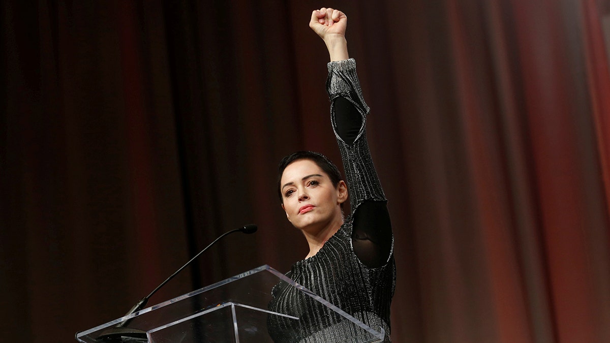 Actor Rose McGowan raises her fist after addressing the audience during the opening session of the three-day Women's Convention at Cobo Center in Detroit, Michigan, U.S., October 27, 2017. REUTERS/Rebecca Cook TPX IMAGES OF THE DAY - RC1A6DD22B20
