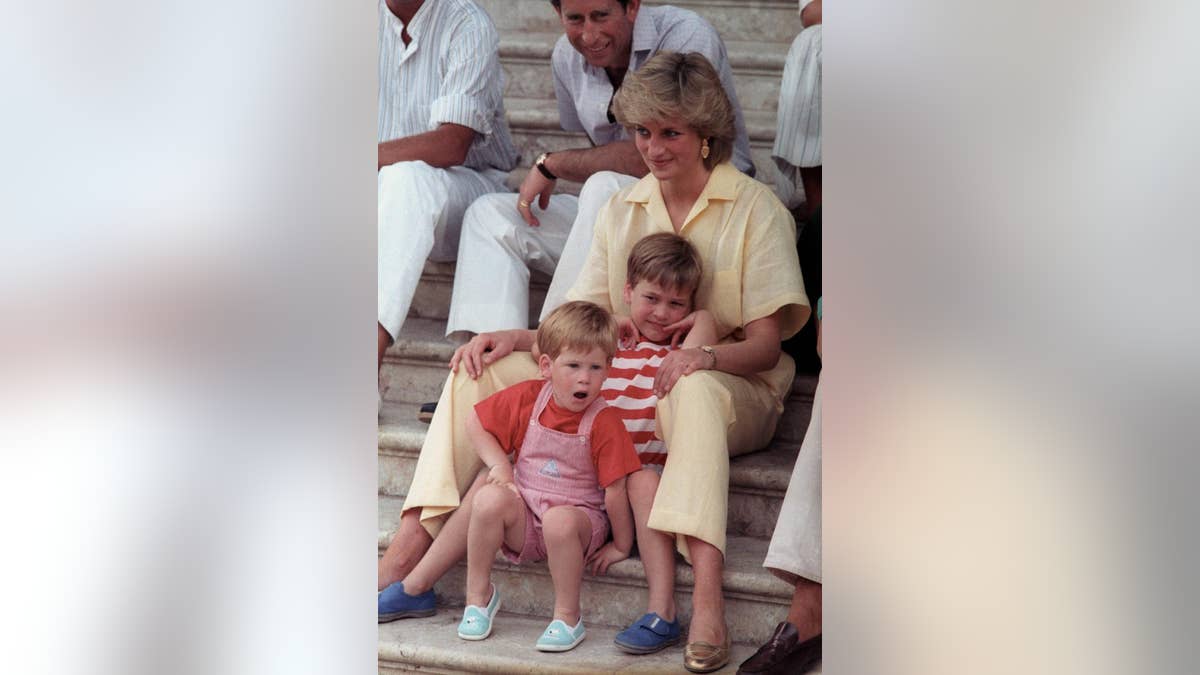 Princess%20Diana%20of%20Wales%20smiles%20as%20she%20sits%20with%20her%20sons%2C%20Princes%20Harry%2C%20front%2C%20and%20William%2C%20on%20the%20steps%20of%20the%20Royal%20Palace%20on%20the%20island%20of%20Majorca%2C%20Spain.%0A