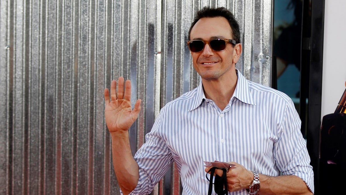 Actor Hank Azaria poses at the premiere of 