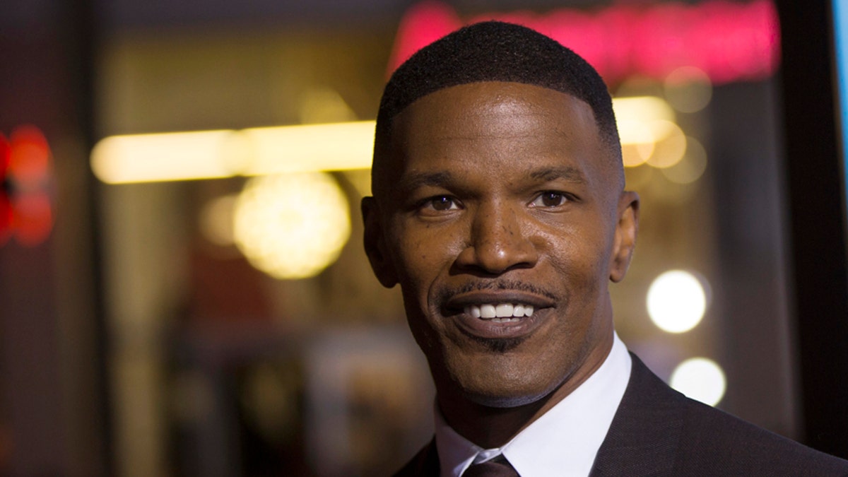 Cast member Jamie Foxx poses at the premiere of 