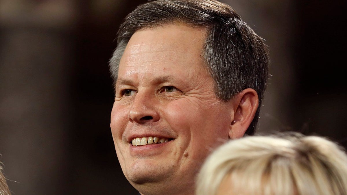 U.S. Senator Steve Daines (R-MT) smiles after he was ceremonially sworn-in by Vice President Joseph Biden in the Old Senate Chamber on Capitol Hill in Washington January 6, 2015.     REUTERS/Larry Downing   (UNITED STATES - Tags: POLITICS HEADSHOT) - GM1EB170DHP01