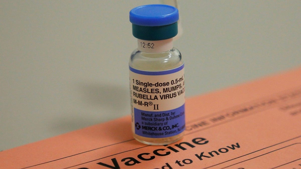 A vial of measles, mumps and rubella vaccine and an information sheet is seen at Boston Children's Hospital in Boston, Massachusetts February 26, 2015.   REUTERS/Brian Snyder    (UNITED STATES - Tags: HEALTH) - GF2EB2Q1F6Z01