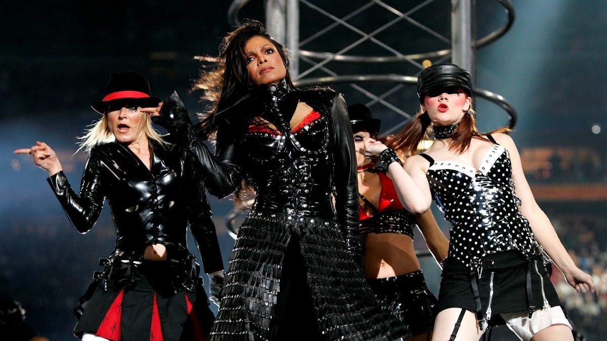 Singer Janet Jackson performs during the halftime show at Super Bowl XXXVIII, February 1, 2004. Jackson turned heads on Sunday night during a half-time appearance with Justin Timberlake during the Carolina Panthers-New England Patriots game, bumping and grinding through a duet. Just as the song came to its close, Timberlake reached for Jackson and tore part of her black leather bustier, revealing one breast. REUTERS/Win McNamee WM/HB - RP4DRIBQZOAA