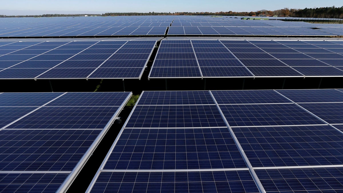 FILE PHOTO: File photo shows a general view of solar panels used to produce renewable energy at the photovoltaic park in Cestas, France, December 1, 2015. REUTERS/Regis Duvignau//File Photo - RC139B3CB920