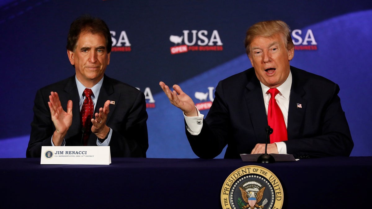 President Donald Trump, accompanied by Rep. Jim Renacci (R-OH), speaks during a roundtable discussion on tax reform at the Cleveland Public Auditorium in Cleveland, Ohio, U.S., May 5, 2018. REUTERS/Aaron P. Bernstein - RC155F9B5980