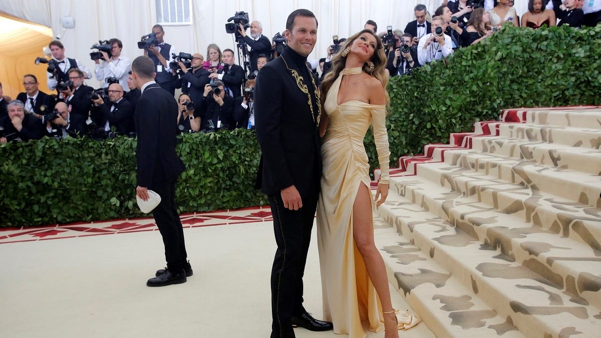 Tom Brady and Gisele Bundchen arrive at the Metropolitan Museum of Art Costume Institute Gala (Met Gala) to celebrate the opening of Heavenly Bodies: Fashion and the Catholic Imagination in the Manhattan borough of New York, U.S., May 7, 2018. REUTERS/Eduardo Munoz - HP1EE58018H87