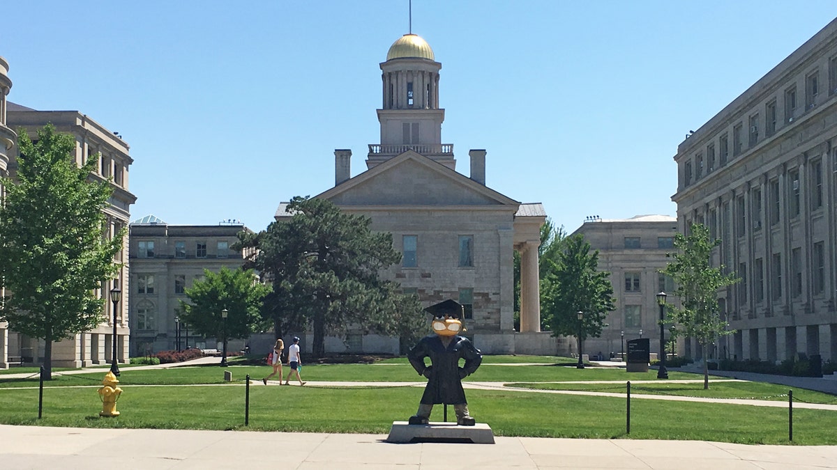 School mascot Herky the Hawk stands in front of the Old Capitol Museum at the University of Iowa, in Iowa City, Iowa, U.S. May 22, 2016.Officials at the university continue to try to determine the extent of cheating that took place this year and involved at least 30 students who allegedly hired imposters to do their coursework.  To move with Special Report  COLLEGE-CHEATING/IOWA       REUTERS/Koh Gui Qing - RTSFXD0