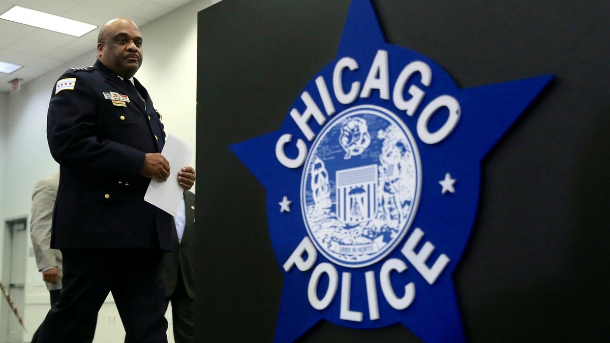 Sign of Chicago police next to officer