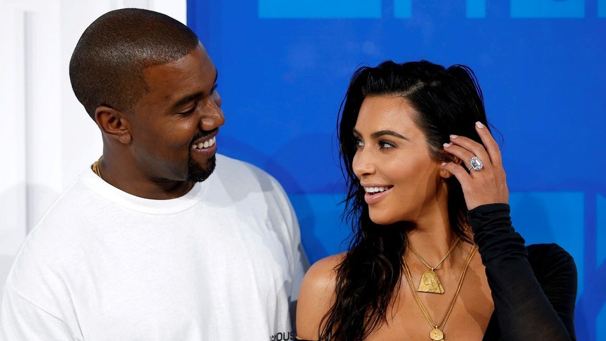 FILE PHOTO - Kim Kardashian and Kanye West arrive at the 2016 MTV Video Music Awards in New York, U.S., August 28, 2016. REUTERS/Eduardo Munoz/File Photo - TM3ECA619J001