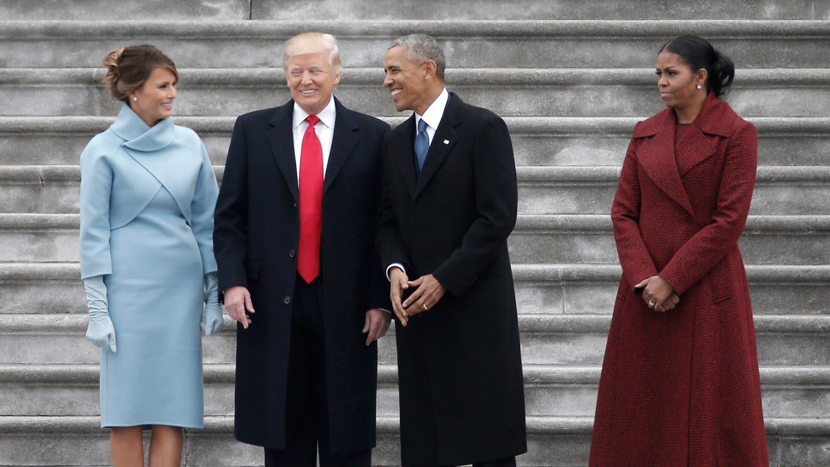 Former president Barack Obama (2nd R) and President Donald Trump share a laugh as former First Lady Michelle Obama (R) and Melania Trump look on following inauguration ceremonies swearing in Trump as the 45th president of the United States on the West front of the U.S. Capitol in Washington, U.S., January 20, 2017. REUTERS/Mike Segar - RTSWJBX