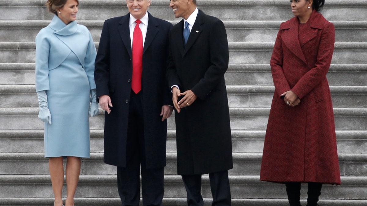 Former president Barack Obama (2nd R) and President Donald Trump share a laugh as former First Lady Michelle Obama (R) and Melania Trump look on following inauguration ceremonies swearing in Trump as the 45th president of the United States on the West front of the U.S. Capitol in Washington, U.S., January 20, 2017. REUTERS/Mike Segar - RTSWJBX