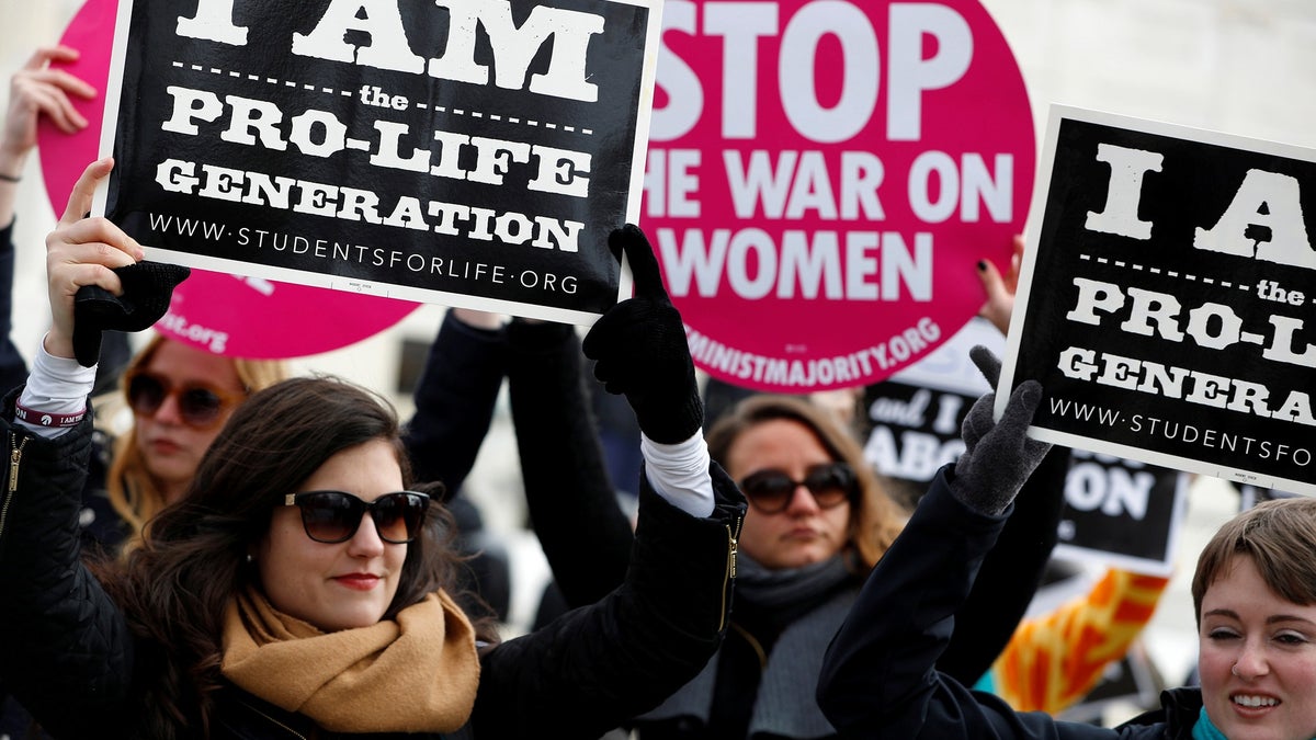 Pro-life activists gather for the National March for Life rally in Washington January 27, 2017.  REUTERS/Aaron P. Bernstein - RC1AFD7066B0