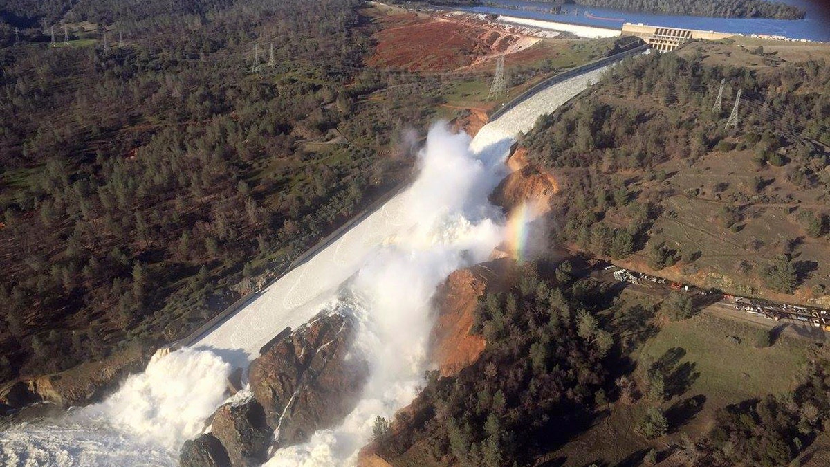 A damaged spillway with eroded hillside is seen in an aerial photo taken over the Oroville Dam in Oroville, California, U.S. February 11, 2017.  California Department of Water Resources/William Croyle/Handout via REUTERS  ATTENTION EDITORS - THIS IMAGE WAS PROVIDED BY A THIRD PARTY. EDITORIAL USE ONLY. THIS PICTURE WAS PROCESSED BY REUTERS TO ENHANCE QUALITY. AN UNPROCESSED VERSION HAS BEEN PROVIDED SEPARATELY.    TPX IMAGES OF THE DAY - RTSYD5R