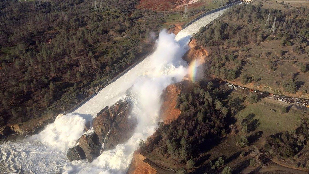 A damaged spillway with eroded hillside is seen in an aerial photo taken over the Oroville Dam in Oroville, California, U.S. February 11, 2017.  California Department of Water Resources/William Croyle/Handout via REUTERS  ATTENTION EDITORS - THIS IMAGE WAS PROVIDED BY A THIRD PARTY. EDITORIAL USE ONLY. THIS PICTURE WAS PROCESSED BY REUTERS TO ENHANCE QUALITY. AN UNPROCESSED VERSION HAS BEEN PROVIDED SEPARATELY.    TPX IMAGES OF THE DAY - RTSYD5R