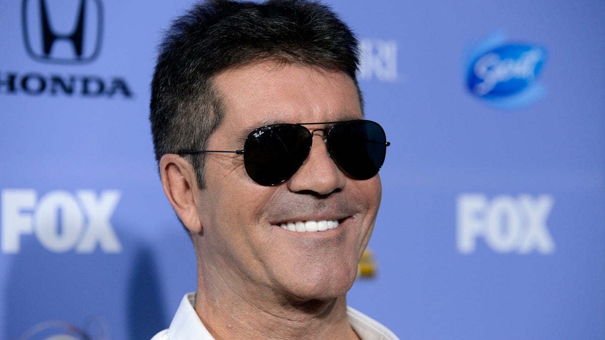 Judge Simon Cowell attends "The X Factor" season three premiere event in West Hollywood, California September 5, 2013. REUTERS/Phil McCarten (UNITED STATES - Tags: ENTERTAINMENT PROFILE HEADSHOT) - RTX1398M