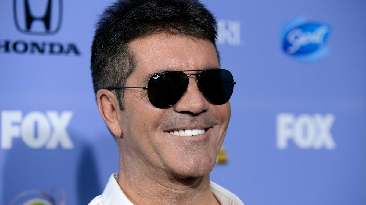 Judge Simon Cowell attends "The X Factor" season three premiere event in West Hollywood, California September 5, 2013. REUTERS/Phil McCarten (UNITED STATES - Tags: ENTERTAINMENT PROFILE HEADSHOT) - RTX1398M