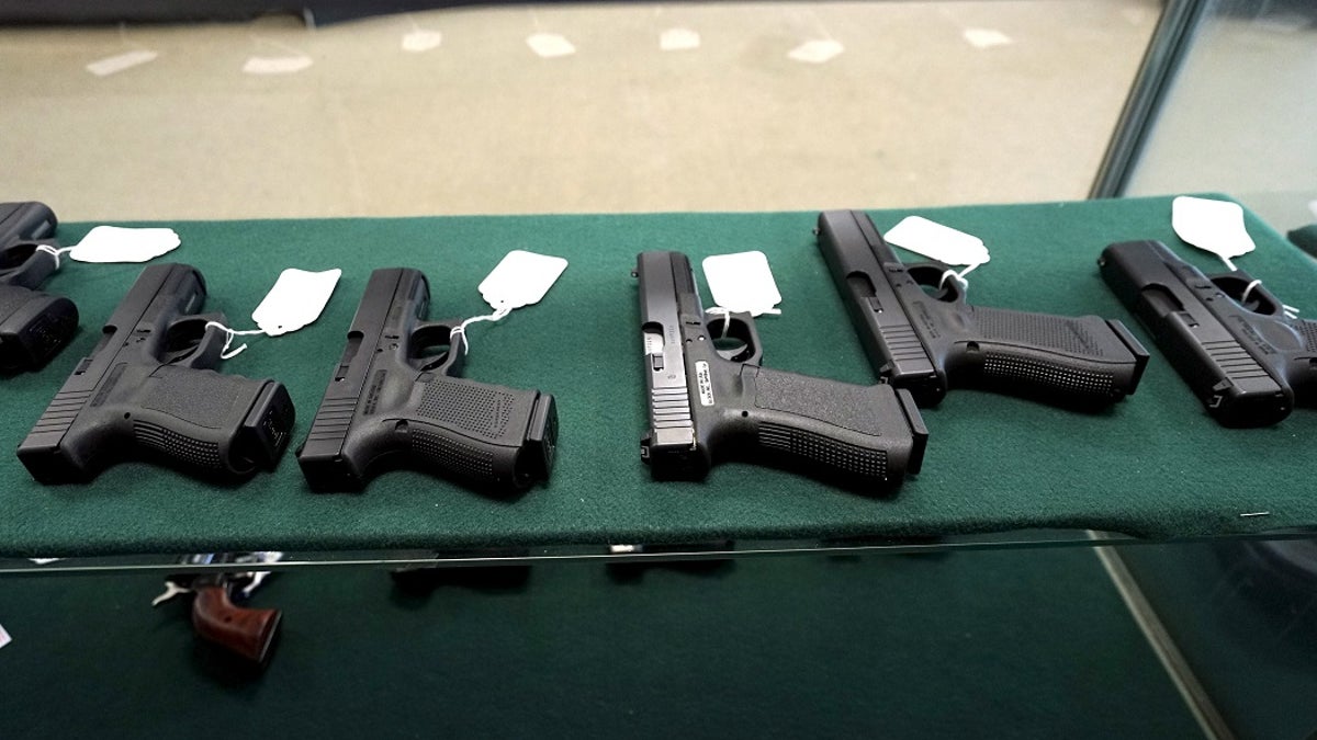 A selection of Glock pistols are seen for sale at the Pony Express Firearms shop in Parker, Colorado December 7, 2015. Many Americans are stocking up on weapons after the country's worst mass shooting in three years. Gun retailers are reporting surging sales, with customers saying they want to keep handguns and rifles at hand for self-defense in the event of another attack. REUTERS/Rick Wilking - GF10000257916