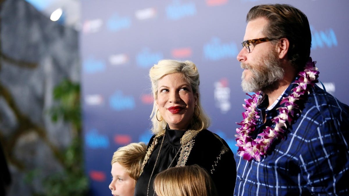 Actor Tori Spelling and husband Dean Mcdermott pose at the world premiere of Walt Disney Animation Studios' "Moana" as a part of AFI Fest in Hollywood, California, U.S., November 14, 2016. REUTERS/Danny Moloshok - D1BEUMXWNHAB