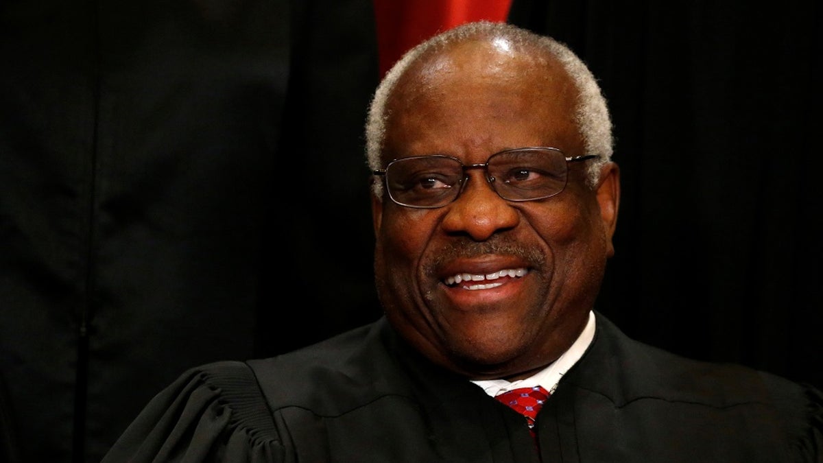 U.S. Supreme Court Justice Clarence Thomas participates in taking a new family photo with his fellow justices at the Supreme Court building in Washington, D.C., U.S., June 1, 2017. REUTERS/Jonathan Ernst - RC15CF6608B0