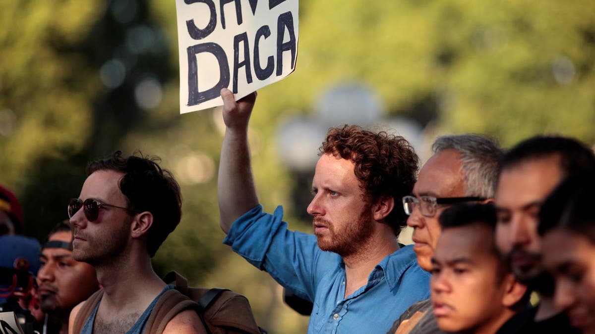 Supporters of the Deferred Action for Childhood Arrivals (DACA) program rally on Olivera Street in Los Angeles, California, September 5, 2017. REUTERS/ Kyle Grillot - RC1D73D54430