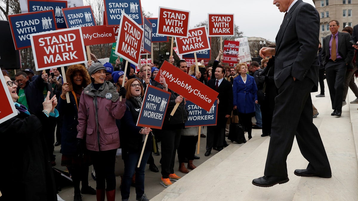 Mark Janus is cheered by supporters outside of the United States Supreme Court in Washington, U.S., February 26, 2018. REUTERS/Leah Millis - RC141D6C4090