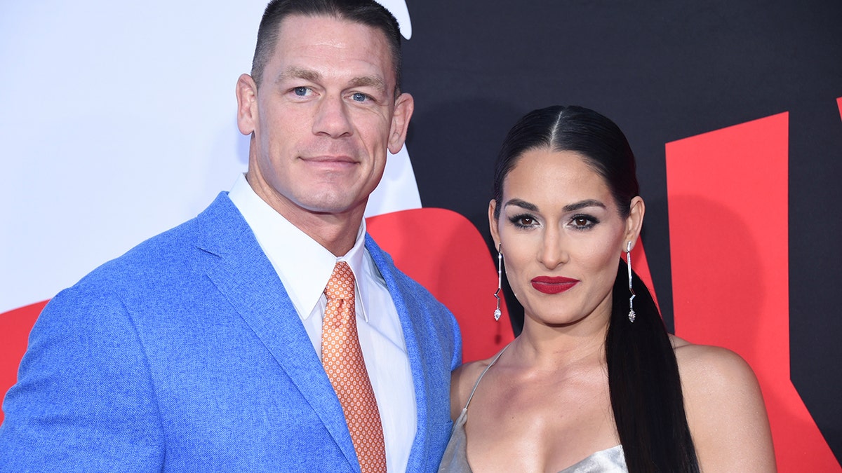 Cast member John Cena (L) and Nikki Bella attend the premiere of 