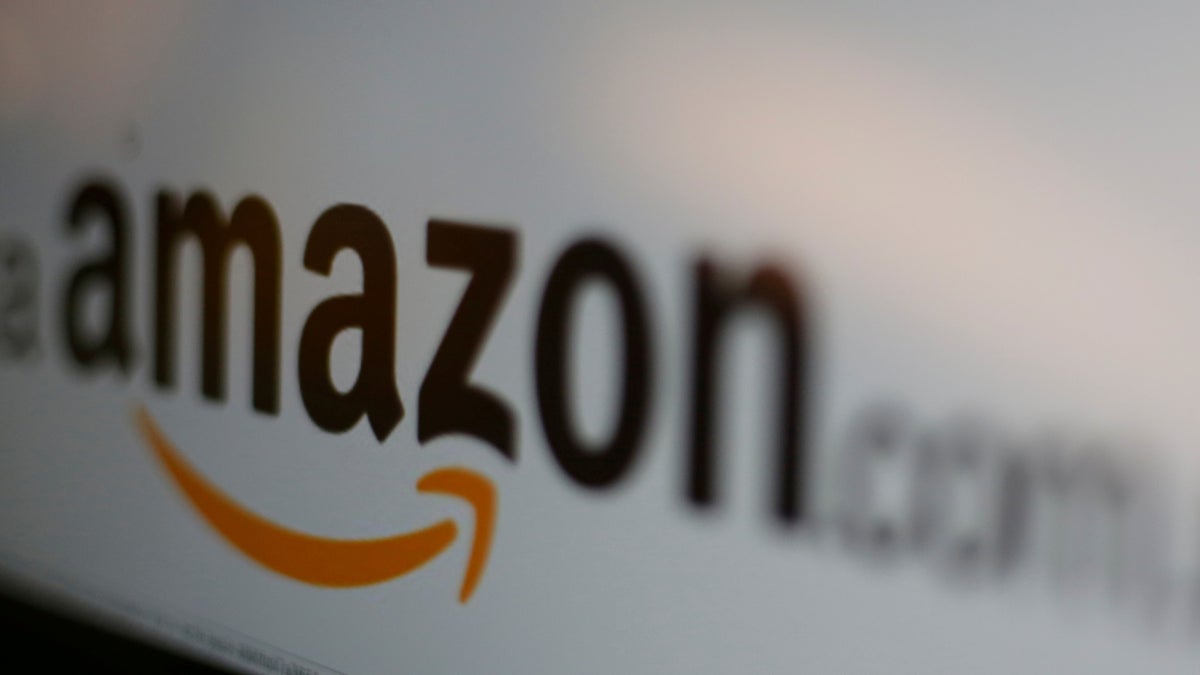 FILE PICTURE - The logo of the web service Amazon is pictured in this June 8, 2017 illustration photo. REUTERS/Carlos Jasso/Illustration/File Photo - RC1847D215A0