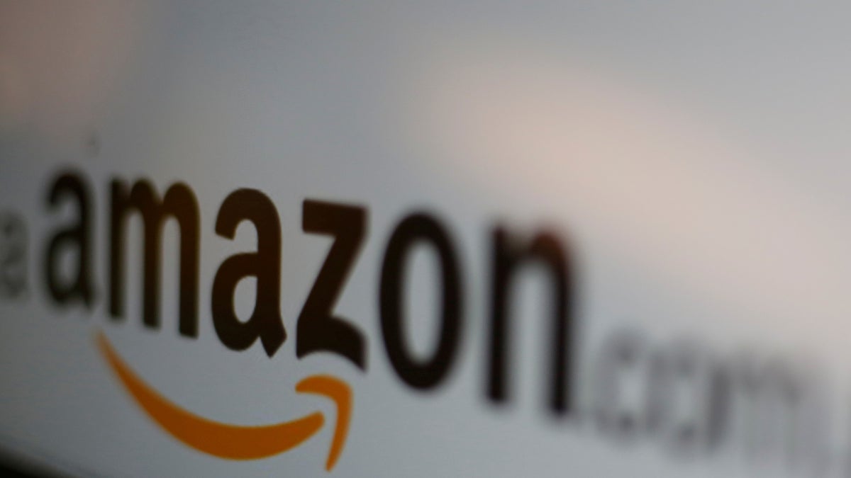 FILE PICTURE - The logo of the web service Amazon is pictured in this June 8, 2017 illustration photo. REUTERS/Carlos Jasso/Illustration/File Photo - RC1847D215A0