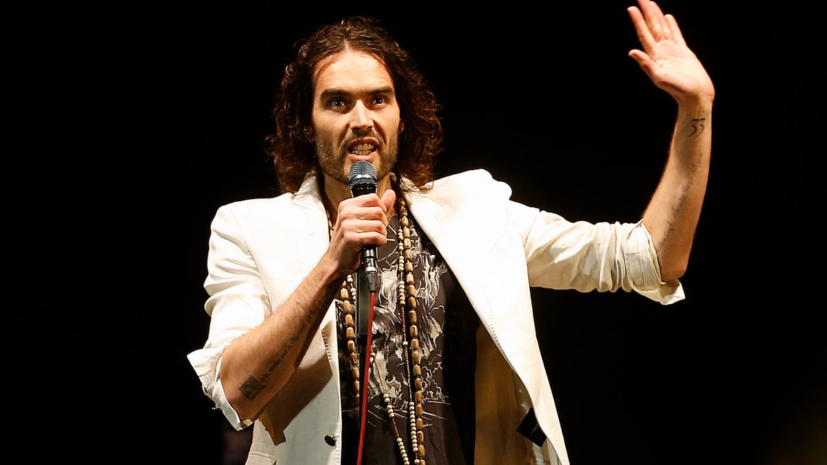 British comedian Russell Brand performs at his Messiah Complex show at Brixton Academy in London March 9, 2014. REUTERS/Olivia Harris (BRITAIN - Tags: ENTERTAINMENT) - RTR3GCSR