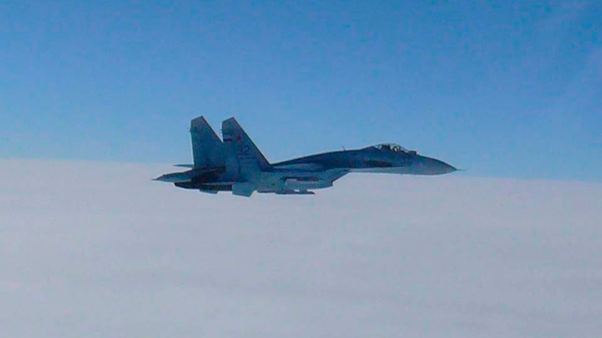 A Russian fighter jet SU-27 flies over the sea off the Japanese northern island of Hokkaido, in this handout photo taken February 7, 2013 by Japan Air Self-Defence Force and released by the Joint Staff Office of the Defense Ministry of Japan. Two Russian fighter jets briefly entered Japan's air space near disputed islands and the northern island of Hokkaido on Thursday, prompting Japan to scramble combat fighters and lodge a protest, Japan's Foreign Ministry said. REUTERS/Joint Staff Office of the Defense Ministry of Japan/Handout (JAPAN - Tags: POLITICS MILITARY) ATTENTION EDITORS - THIS IMAGE WAS PROVIDED BY A THIRD PARTY. FOR EDITORIAL USE ONLY. NOT FOR SALE FOR MARKETING OR ADVERTISING CAMPAIGNS. IT IS DISTRIBUTED, EXACTLY AS RECEIVED BY REUTERS, AS A SERVICE TO CLIENTS - GM1E9280STK01