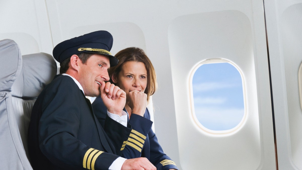 Flight personnel on airplane