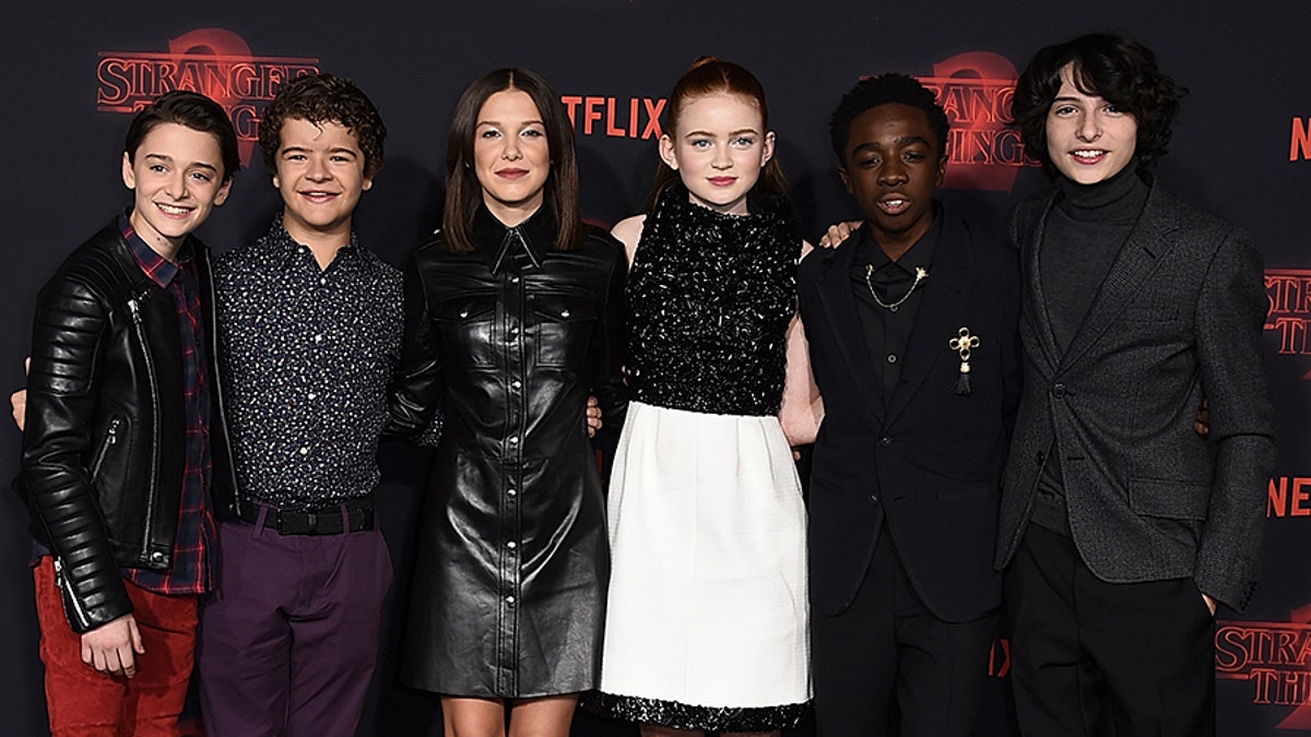 Noah Schnapp, from left, Gaten Matarazzo, Millie Bobby Brown, Sadie Sink, Caleb McLaughlin and Finn Wolfhard arrive at the premiere of 