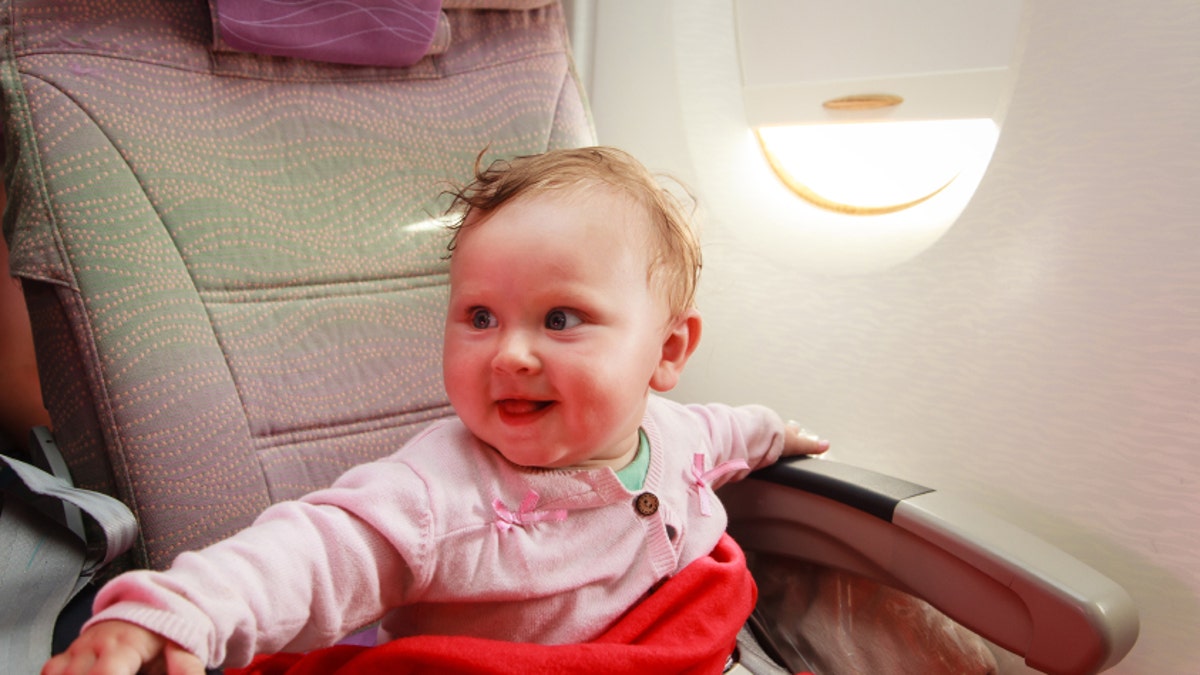 little girl travelling by plane