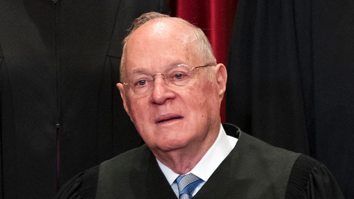 Justice Anthony Kennedy sits during group SCOTUS photo