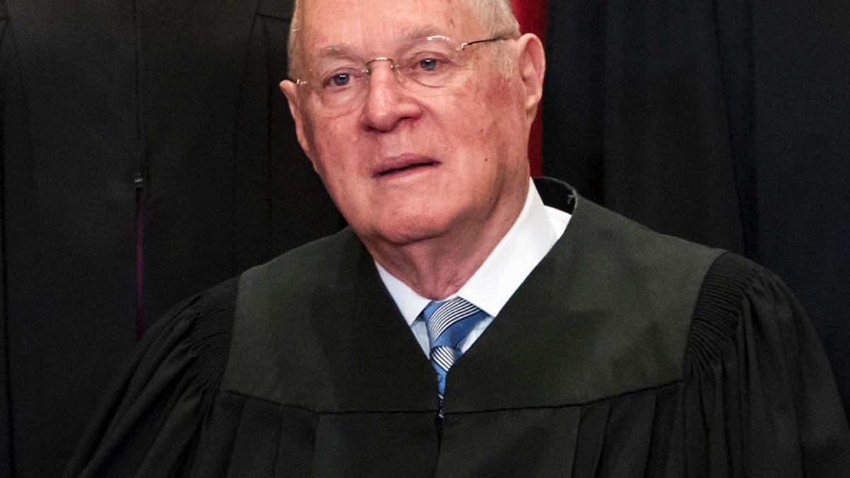 Justice Anthony Kennedy sits during group SCOTUS photo