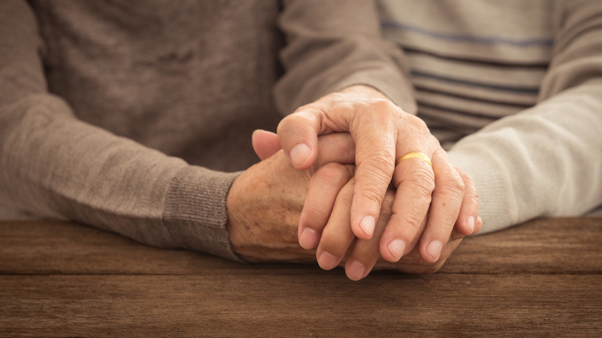 senior couple hands holding hands istock large