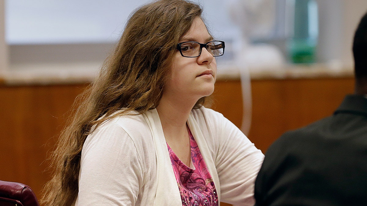 FILE - In this Sept. 13, 2017 file photo, Anissa Weier, listens as former teachers testify during her trial in Waukesha County Court, in Waukesha, Wis. One of the two Wisconsin girls accused of stabbing a classmate, Payton Leuter, in 2014 to gain the favor of a horror character named Slender Man will soon learn how long she will spend in a mental health facility. A judge in Waukesha County Circuit Court on Thursday, Dec. 21, 2017, is expected to send 16-year-old Weier to a facility for at least three years after she was previously found not guilty by reason of mental disease or defect. (Rick Wood/Milwaukee Journal-Sentinel via AP, Pool, File)