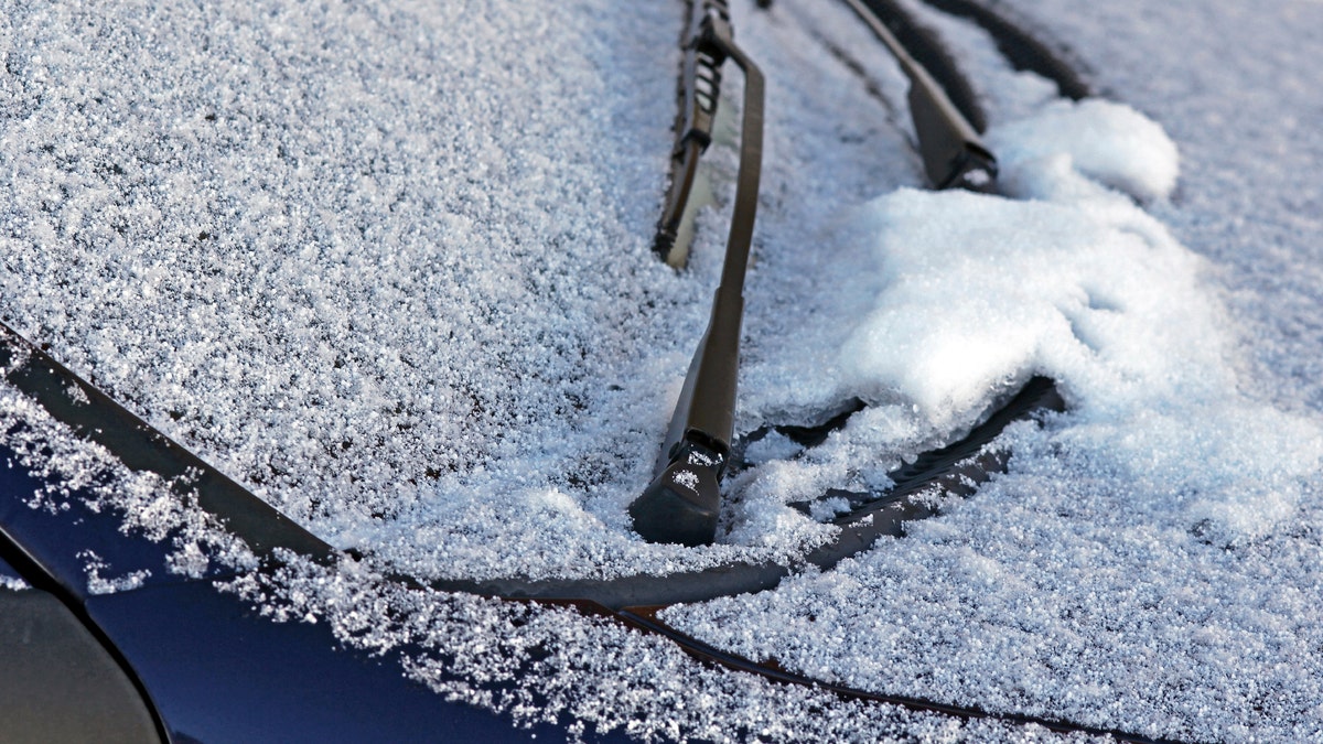 snow on car windshield istock