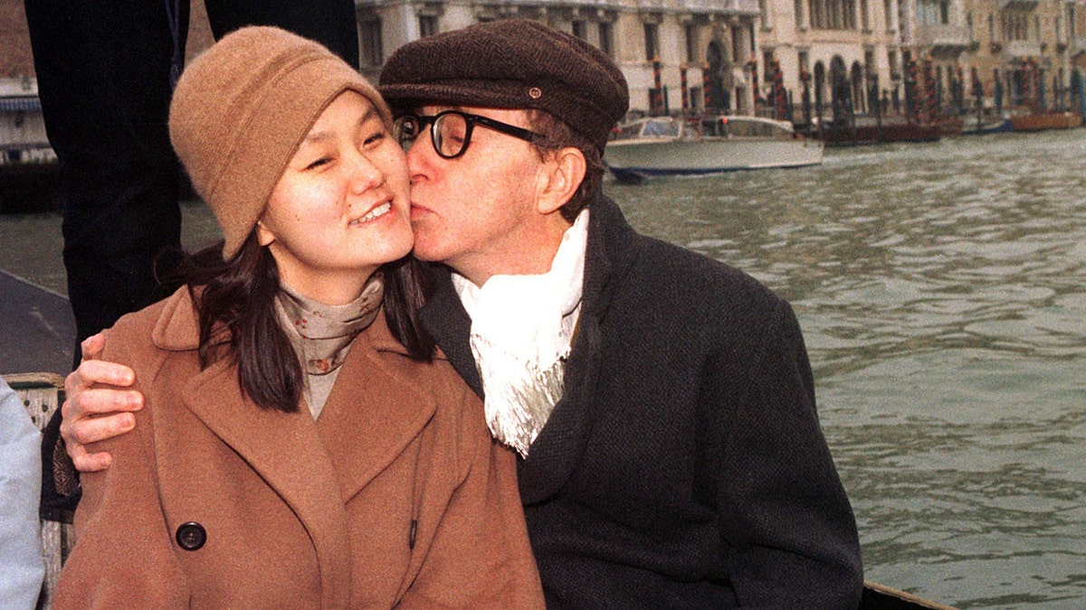 U.S. actor and filmaker Woody Allen kisses Soon-Yi Previn, the adopted daughter of his former lover Mia Farrow, in a gondola in Venice's Grand Canal December 24. Allen 62, and Previn, 27, were married in a secret civil ceremony December 23, officiated by Venice Mayor Massimo Cacciari, at the imposing Palazzo Cavalli.ITALY ALLEN - RP1DRIDEFJAB