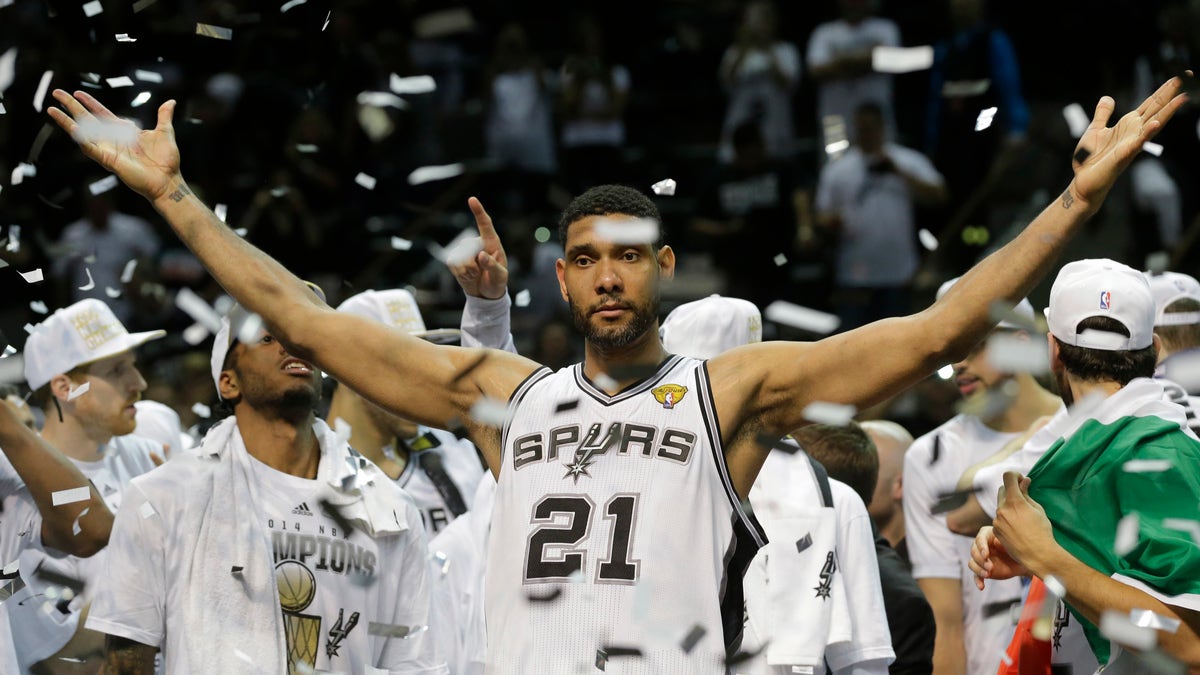 FILE - In this June 15, 2014, file photo, San Antonio Spurs forward Tim Duncan (21) celebrates after Game 5 of the NBA basketball finals in San Antonio. Duncan announced his retirement on Monday, July 11, 2016, after 19 seasons, five championships, two MVP awards and 15 All-Star appearances. It marks the end of an era for the Spurs and the NBA.  (AP Photo/David J. Phillip, File)