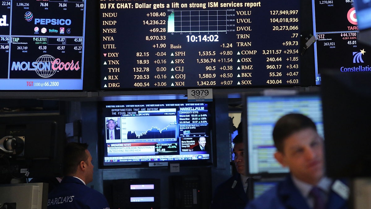 NEW YORK, NY - MARCH 05: Traders work on the floor of The New York Stock Exchange on March 5, 2013 in New York City. Within the first few minutes of trading Tuesday, the Dow gained nearly 100 points, rising as high as 14,226.20, a new record high (Photo by Spencer Platt/Getty Images)