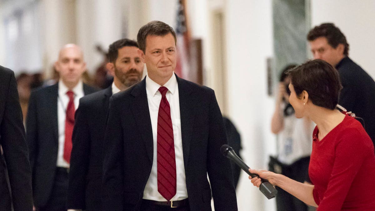 FILE - In this June 27, 2018, file photo, Peter Strzok, the FBI agent facing criticism following a series of anti-Trump text messages, walks to gives a deposition before the House Judiciary Committee on Capitol Hill in Washington. Strzok, whose anti-Trump text messages fueled suspicions of partisan bias will tell lawmakers July 12 that his law enforcement work has never been tainted by political considerations and that the intense congressional scrutiny of him represents âjust another victory notch in Putinâs belt,â according to prepared remarks obtained by The Associated Press.(AP Photo/J. Scott Applewhite, File)